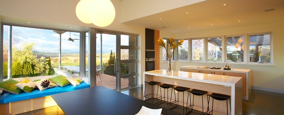 Large white aluminium window in bedroom